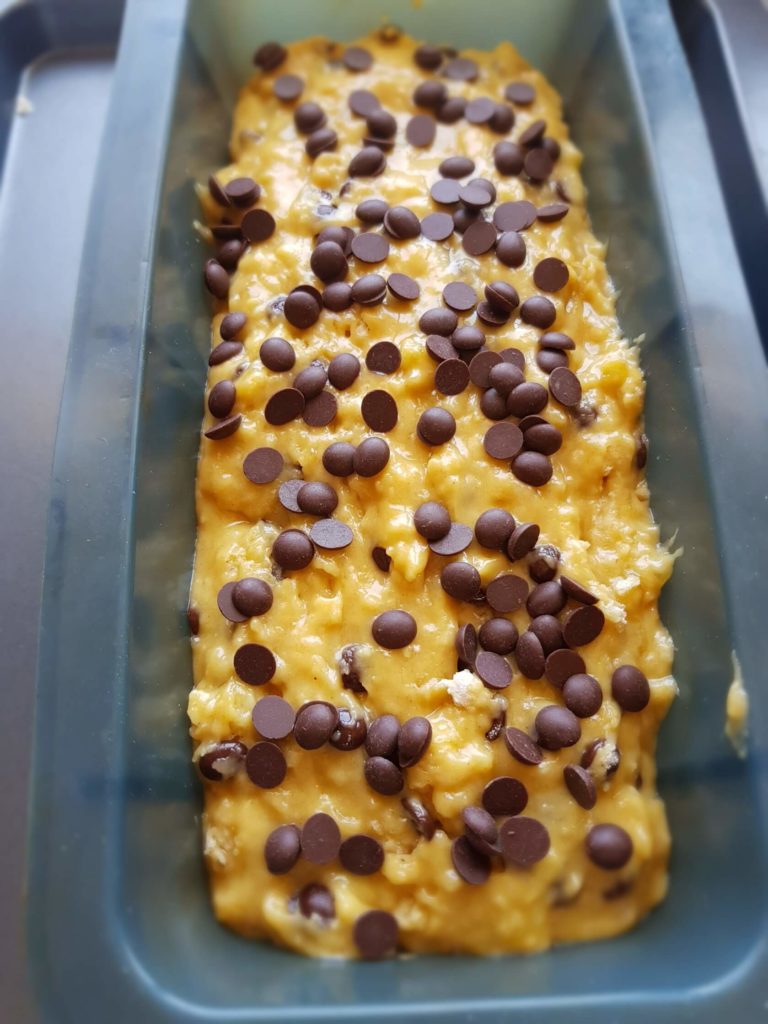 Banana chocolate chip bread mix in loaf tin before it is cooked