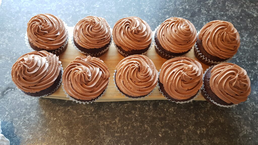 Simple homemade chocolate cupcake with chocolate buttercream frosting